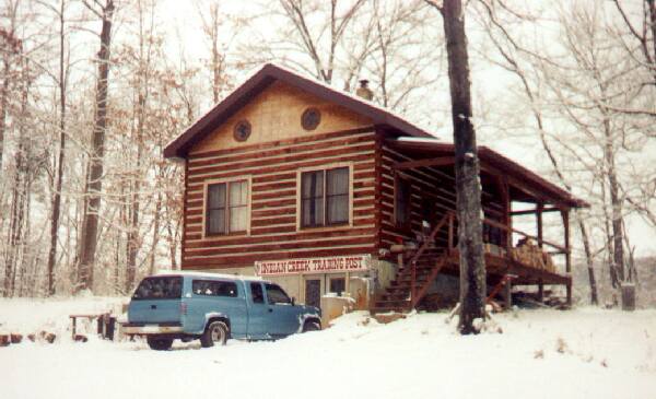 Photo of our new Trading Post and home - log cabin in the woods.